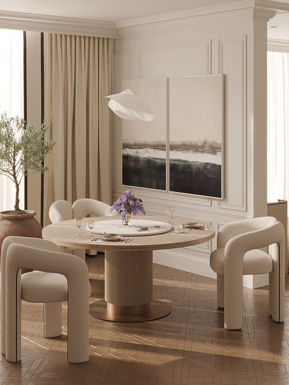 Minimalist dining space with sculptural chairs, round wooden table, and abstract art — sunlight casting soft shadows in a serene Maison Révèle atmosphere.